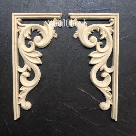 WoodUBend Corner Applique #2160 set of 2
There are two, wood-u-bend corner pieces.  They are placed side-by-side, facing each other.  There is a 90 degree frame around the Victorian curved and embellished piece. They are resting on black leather that fills the picture from edge to edge.