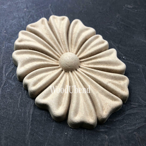 WoodUBend Floral Applique #1333.1 (Set of 2) is the perfect mouldable embellishment for any project!
Image shows one of the Floral Applique #1333.1 Set of 2 out of the packaging, staged flat on a black background.