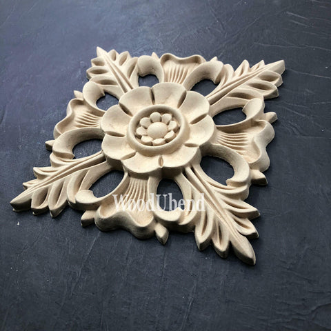 WoodUBend Floral Applique #1352.18 (Set of 2) is the perfect mouldable embellishment for any project!
Image shows one of the Floral Applique #1352.18 Set of 2, staged on an angle on a black background.