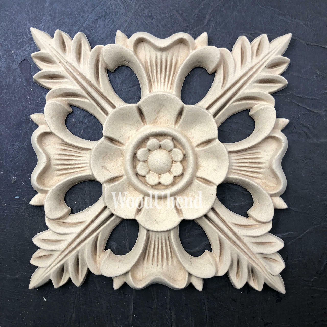 WoodUBend Floral Applique #1352.18 (Set of 2) is the perfect mouldable embellishment for any project!
Image shows one of the Floral Applique #1352.18 Set of 2 out of the packaging, staged flat on a black background.