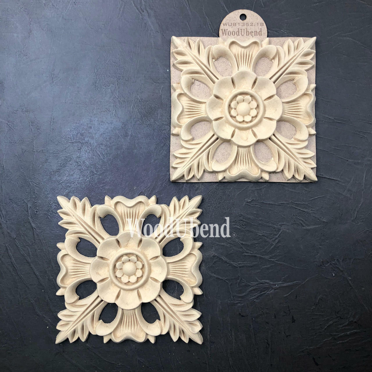 WoodUBend Floral Applique #1352.18 (Set of 2) is the perfect mouldable embellishment for any project!
Image shows the full set of Floral Applique #1352.18 staged diagonally besides each other, one in its packaging the other one out, on top of a black background.