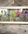 WoodUBend Floral Applique #1479 (Set of 5) is the perfect mouldable embellishment for any project!
A framed clear plastic with the Wildflowers & Butterflies - Transfer, on all 4 corner of the frame is the Floral Applique #1479 . Staged hanging on a rustic wood wall.