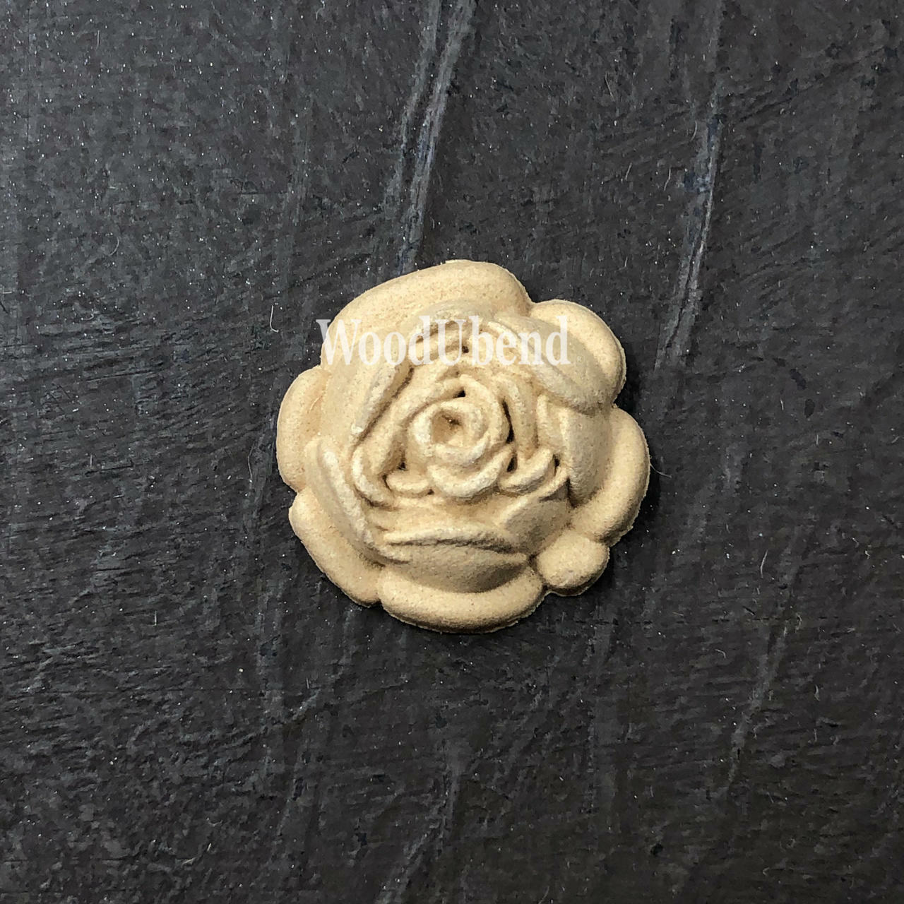 WoodUBend Floral Applique #319 is the perfect mouldable embellishment for any project!
The Floral Applique #319 staged flat on a black background.