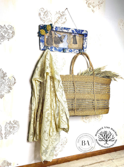 WoodUBend Floral Applique #465 (set of 5) is the perfect moldable embellishment for any project!
Shows a Wall mounted coat hanger decked out in Blue Sketched Flowers - Rice Decoupage Paper in the corner of the coat hanger has Floral Applique #465 in yellow with green leaves. Staged with a woven bag and a lace jacket hanging on the coat hanger.