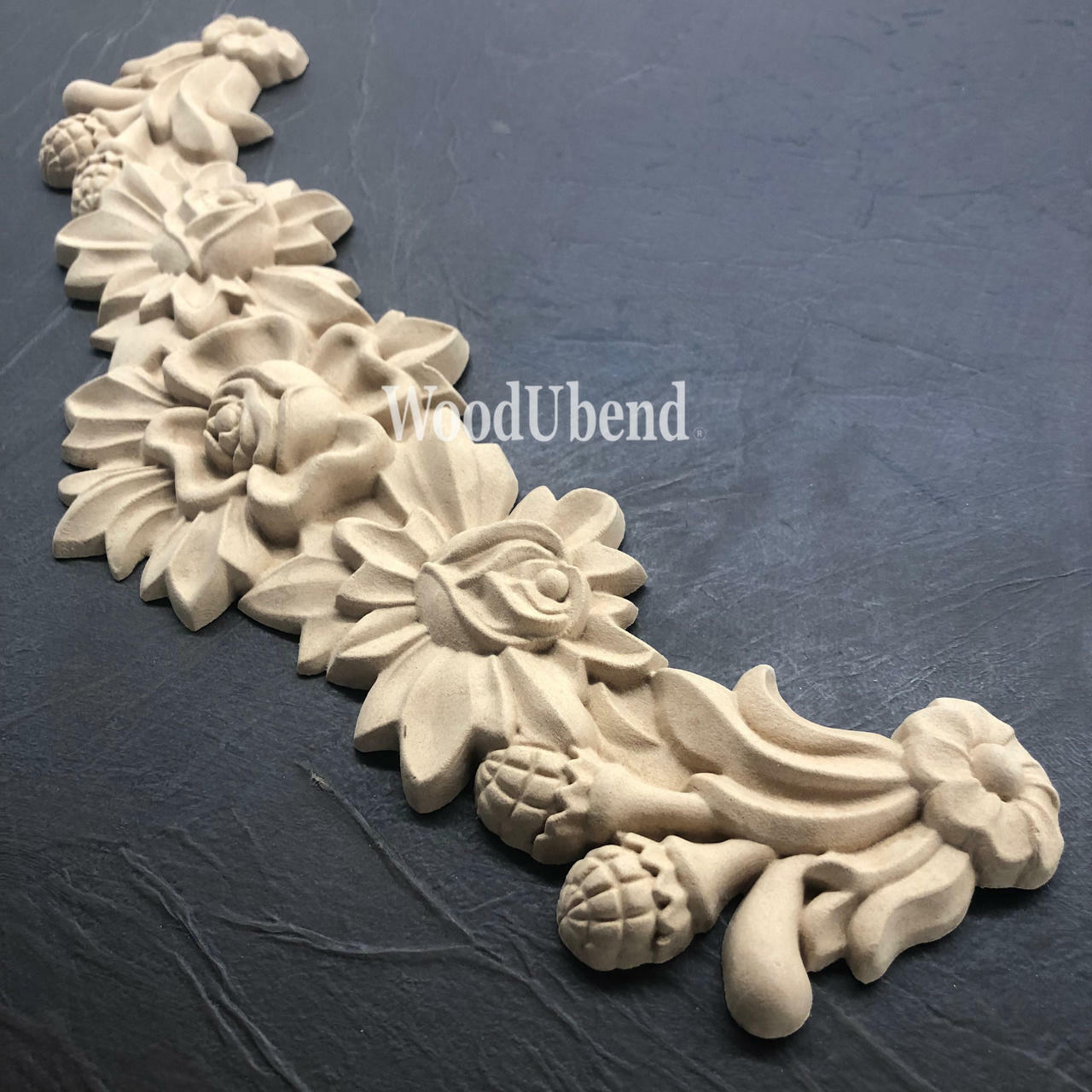 WoodUBend Floral Applique #X1001 is the perfect moldable embellishment for any project!
The Floral Applique #X1001 laid flat on a black crinkle background.