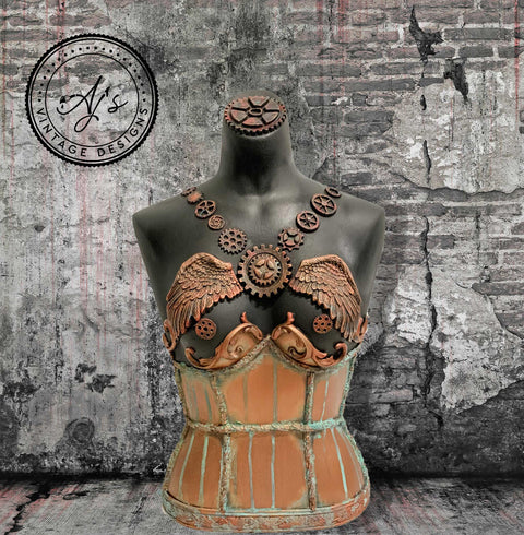 WoodUBend Gear Collection Appliques #56 is the perfect mouldable embellishment for any project!
A mannequin torso with the Gear Collection Appliques #56 in the middle and going up the chest over the shoulders.