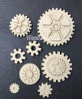 WoodUBend Gear Collection Appliques #56 is the perfect mouldable embellishment for any project!
The Gear Collection Appliques #56 without its packaging staged on a black crinkled background.