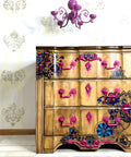 WoodUBend Keyhole #1147 (Set of 5) is the perfect mouldable embellishment for any project!
Dresser lightly stained in Tobacco Road VooDoo Gel Stain along with Latin Floral Transfer along the drawers and body of the dresser. The Keyhole #1147 in hot pink going down the center of the piece, both the hardware and applique are with a dripping paint effect.