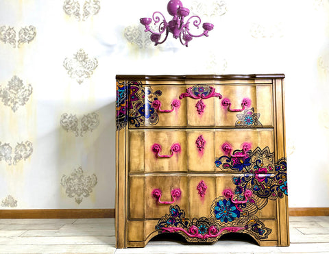 WoodUBend Keyhole #1147 (Set of 5) is the perfect mouldable embellishment for any project!
Dresser lightly stained in Tobacco Road VooDoo Gel Stain along with Latin Floral Transfer along the drawers and body of the dresser. The Keyhole #1147 in hot pink going down the center of the piece, both the hardware and applique are with a dripping paint effect.