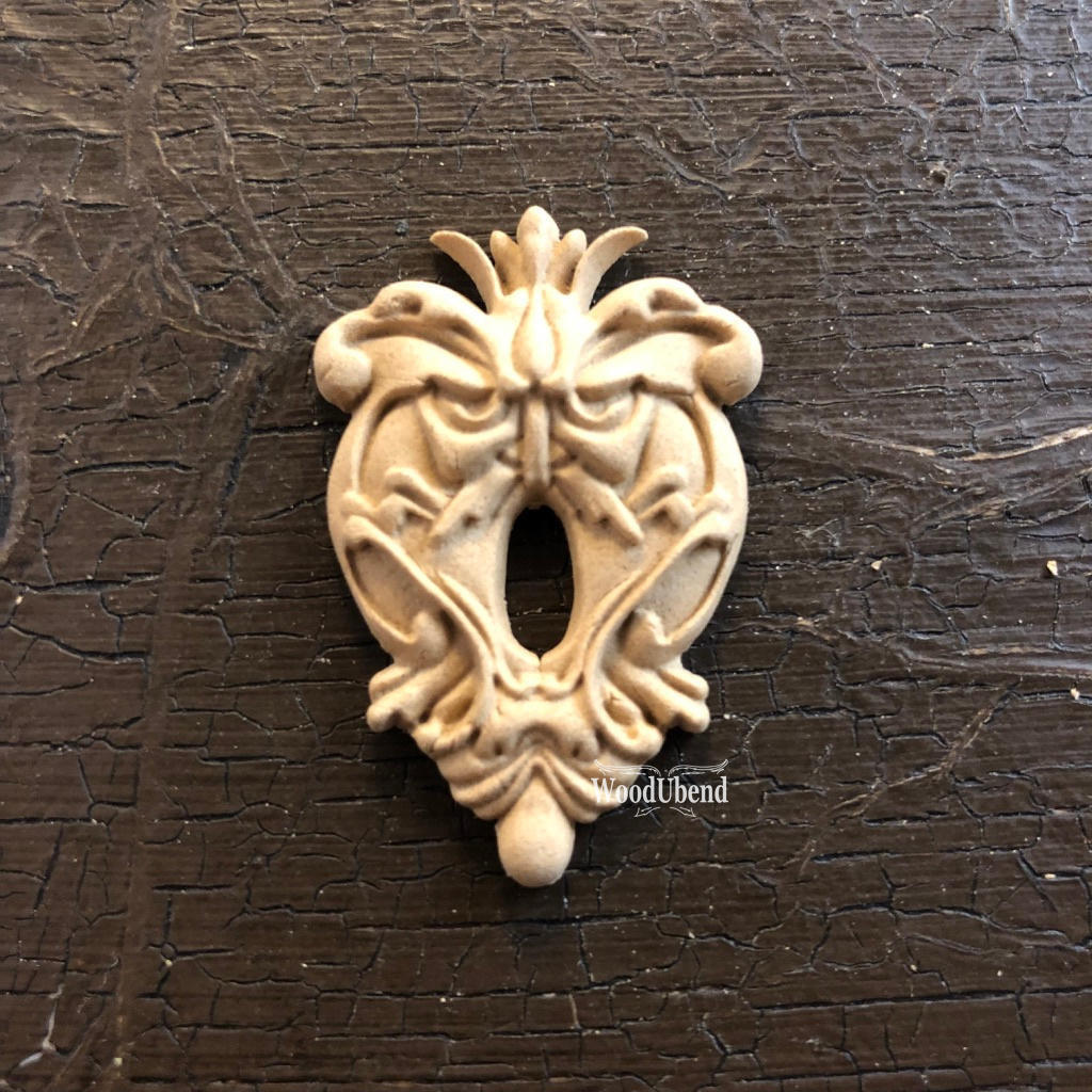 WoodUBend Keyhole #987 is the perfect mouldable embellishment for any project!
The Keyhole #987 staged flat on a black background.