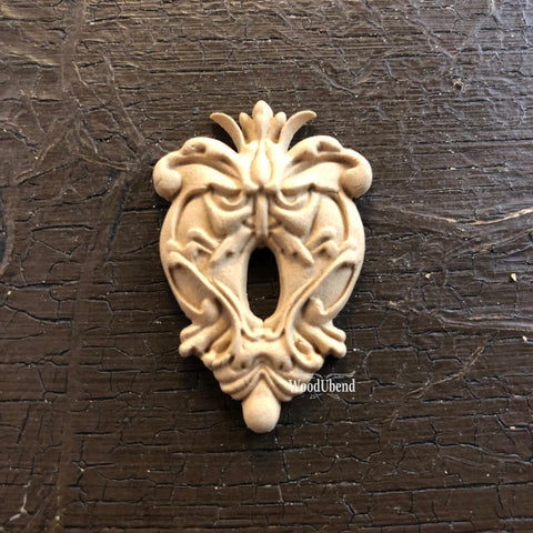 WoodUBend Keyhole #987 is the perfect mouldable embellishment for any project!
The Keyhole #987 staged flat on a black background.