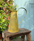 Metal watering can sprayed with Yellow Patina Spray.