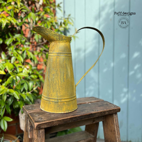 Metal watering can sprayed with Yellow Patina Spray.